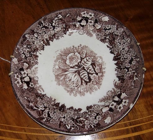 plate with brown flowers